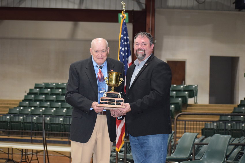 Ray Crocker, left, receives the Neshoba County Citizen of the Year from Tim Moore during last Thursday’s annual Veterans Day ceremony at the Neshoba County Coliseum. 